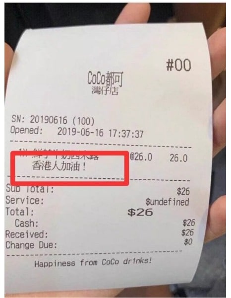 CoCo Bubble Tea in Hot Water over Pro-Hong Kong Text on Receipts